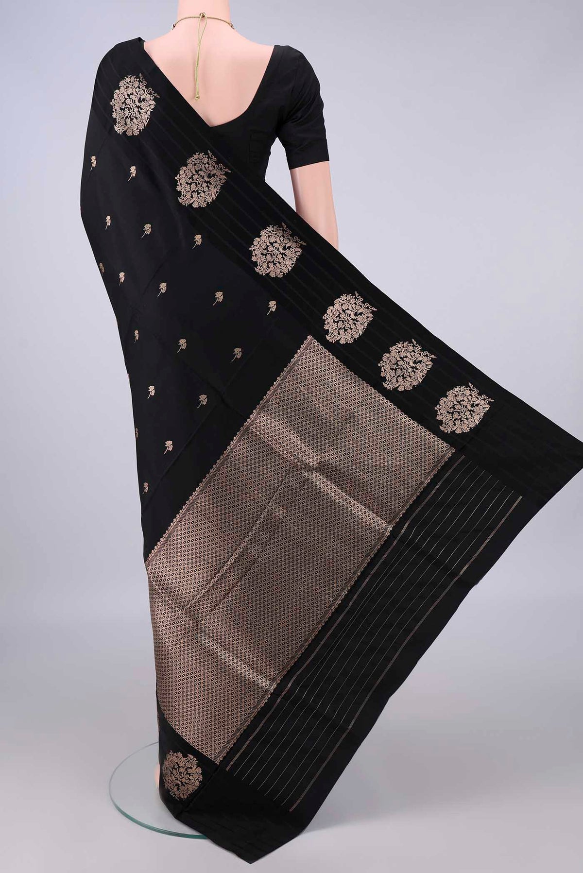 Flat view of Pure Silk Black Banarasi Katan Saree with Zari Butta on the body and Zari Border. 