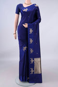 Pure Silk Navy Blue Banarasi Katan Saree with Zari Butta on the body and Zari Border.  displayed on a mannequin