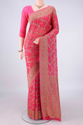 Coral Banarasi Georgette Saree with Zari Brocade on the body and Zari Border.  displayed on a mannequin