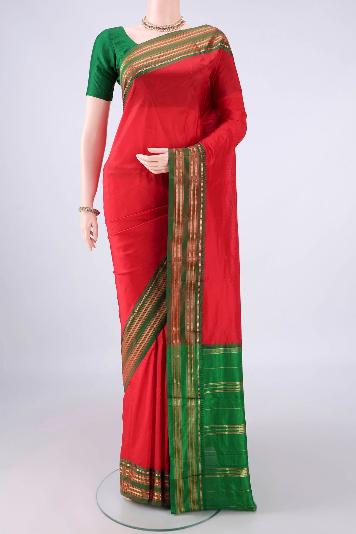 Pure Silk Red Narayanpet Saree with Plain Body and Zari Border.  displayed on a mannequin