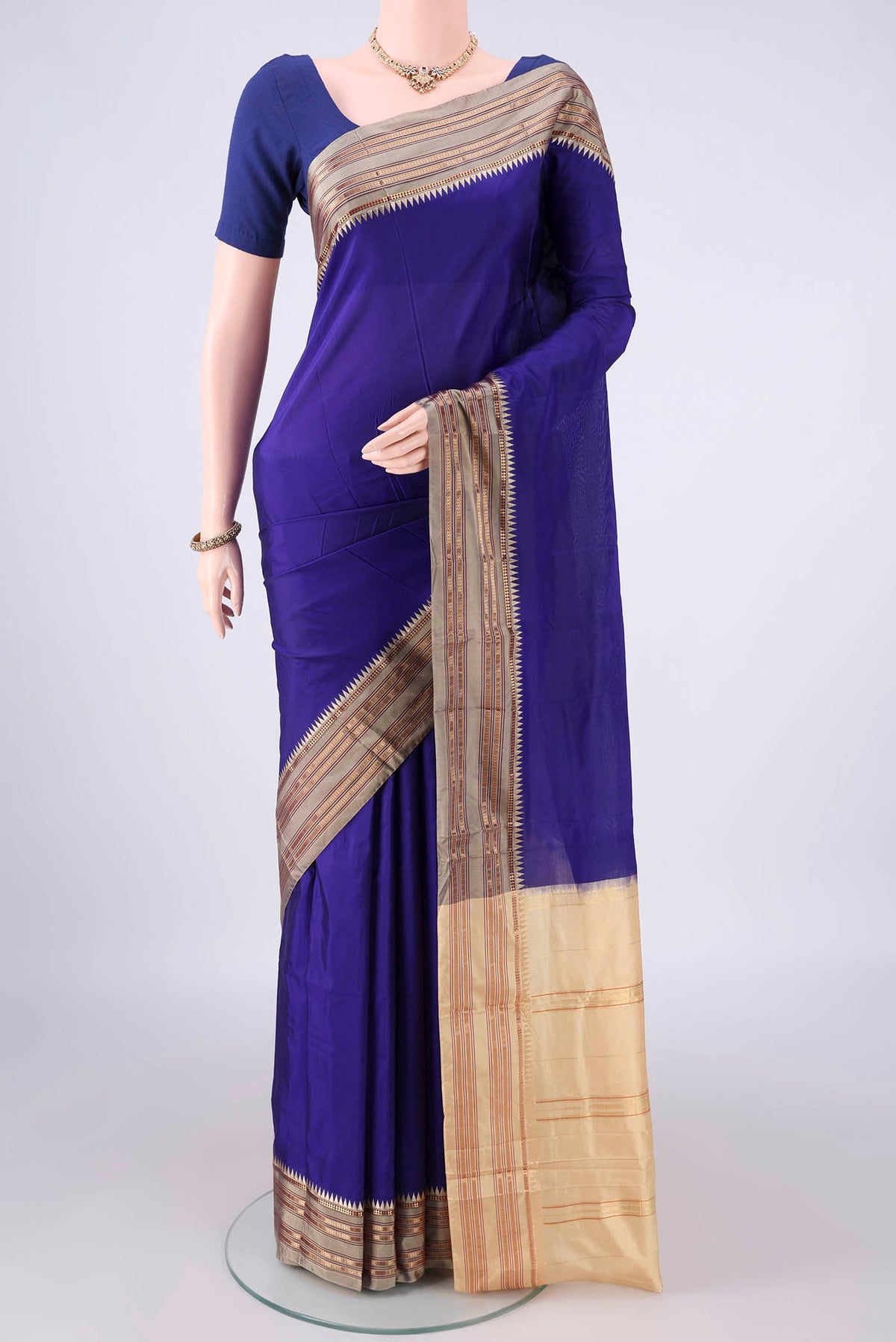 Pure Silk Dark Blue Narayanpet Saree with Plain Body and Zari Border.  displayed on a mannequin