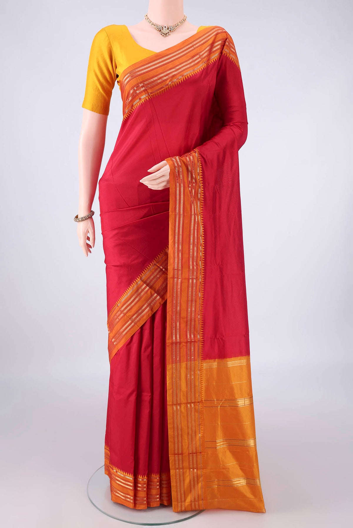 Pure Silk Red Narayanpet Saree with Plain Body and Zari Border.  displayed on a mannequin
