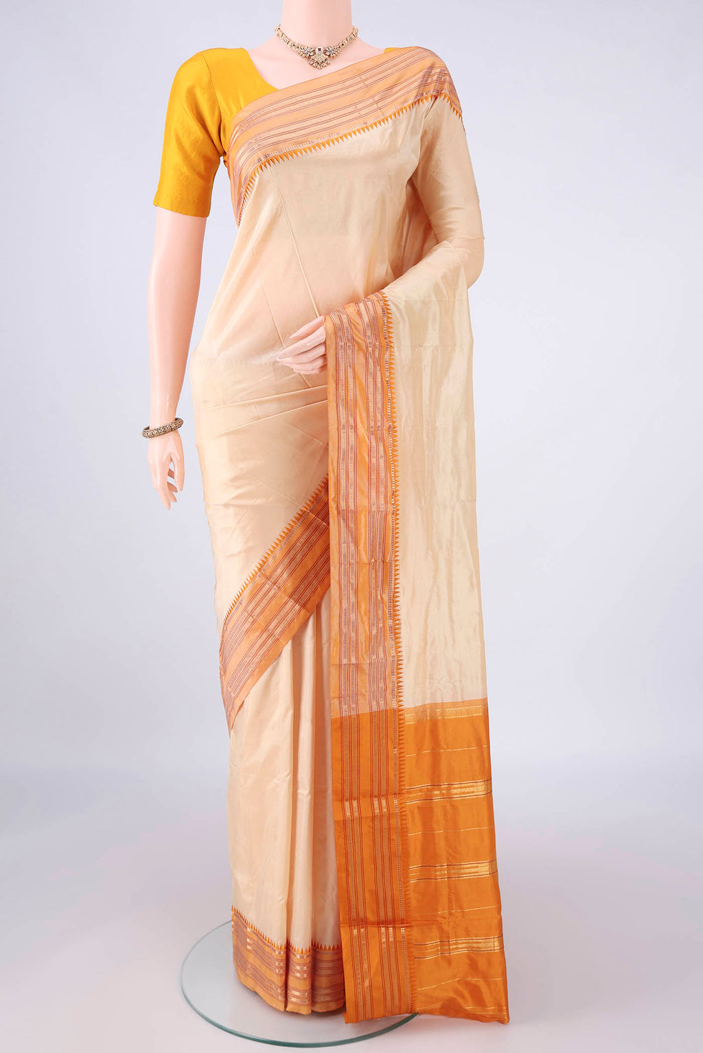 Pure Silk Sandal Narayanpet Saree with Plain Body and Zari Border.  displayed on a mannequin