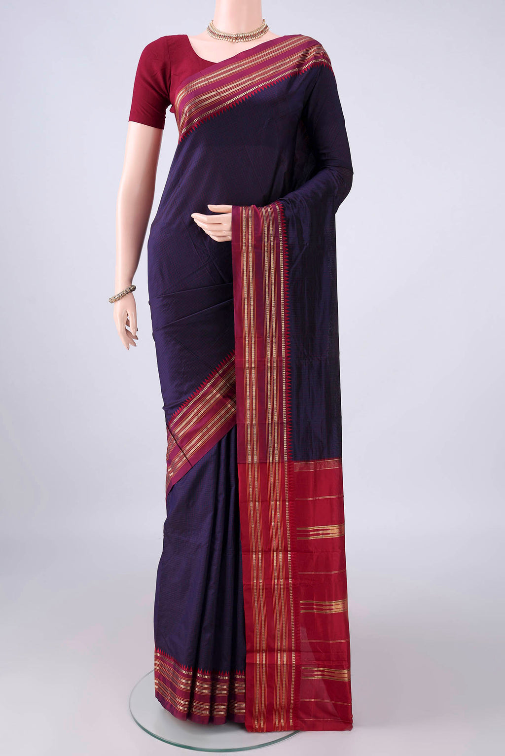 Pure Silk Navy Blue Narayanpet Saree with Checked design on the body and Zari Border.  displayed on a mannequin