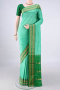 Pure Silk Sea Green Narayanpet Saree with Checked design on the body and Zari Border.  displayed on a mannequin