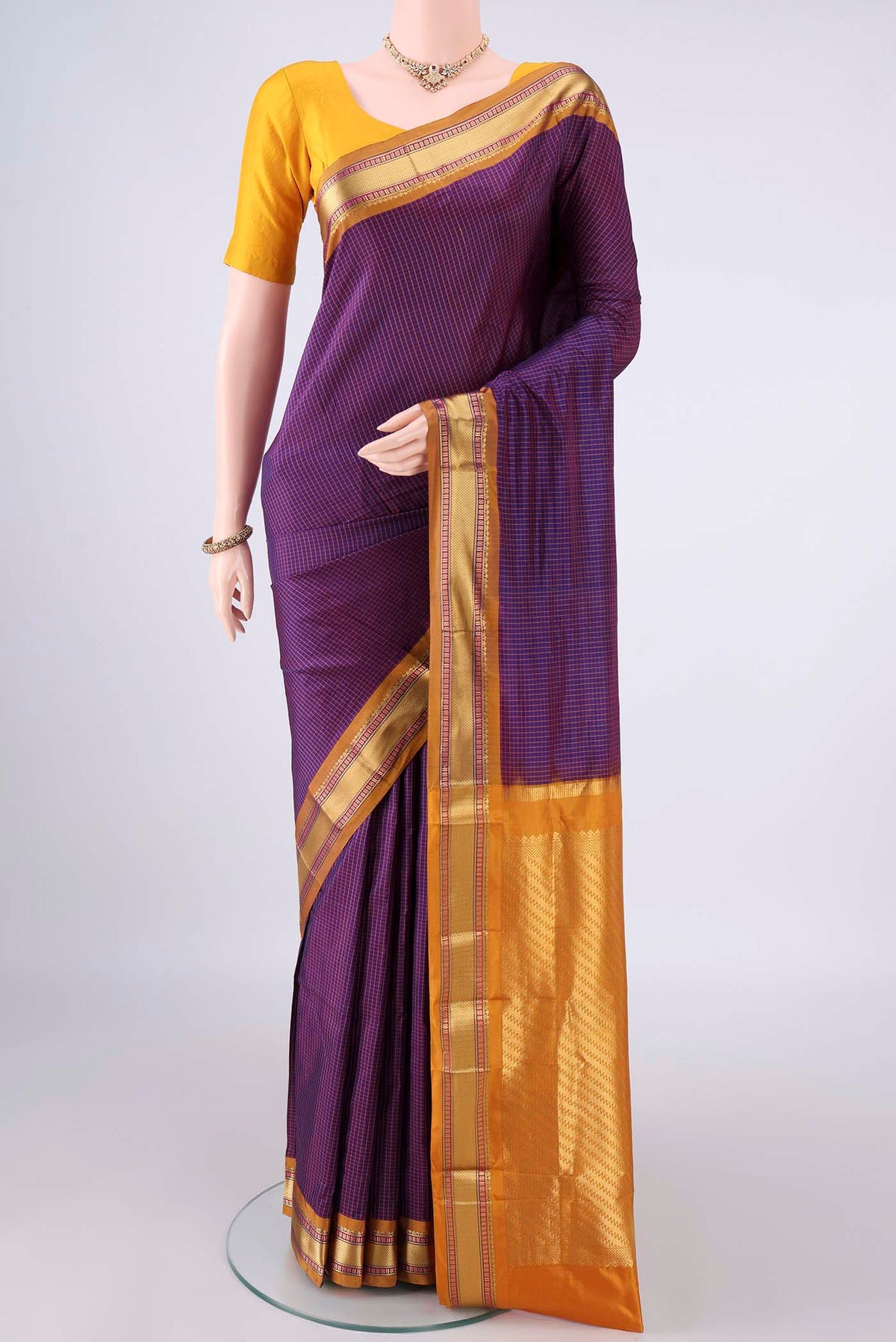 Pure Silk Purple Narayanpet Saree with Checked design on the body and Zari Border.  displayed on a mannequin