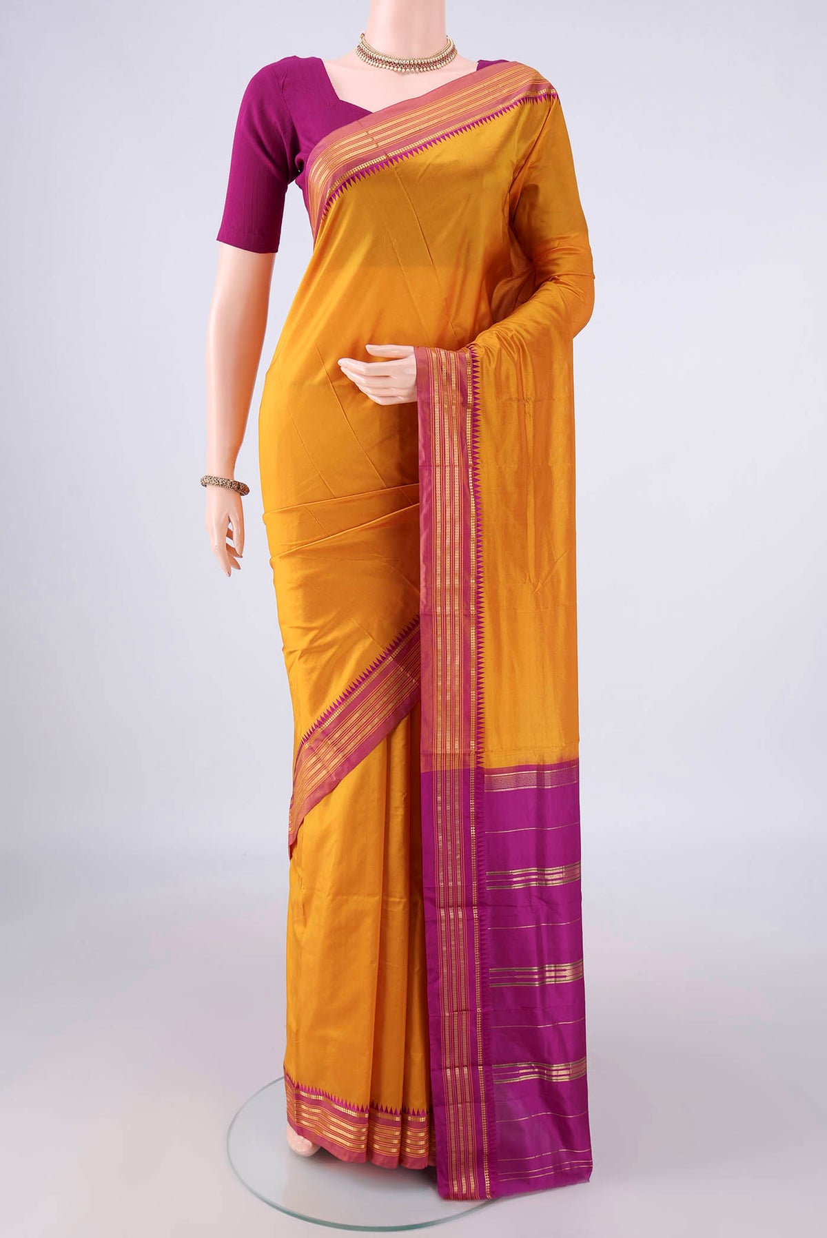 Pure Silk Mustard Narayanpet Saree with Plain Body and Zari Border.  displayed on a mannequin