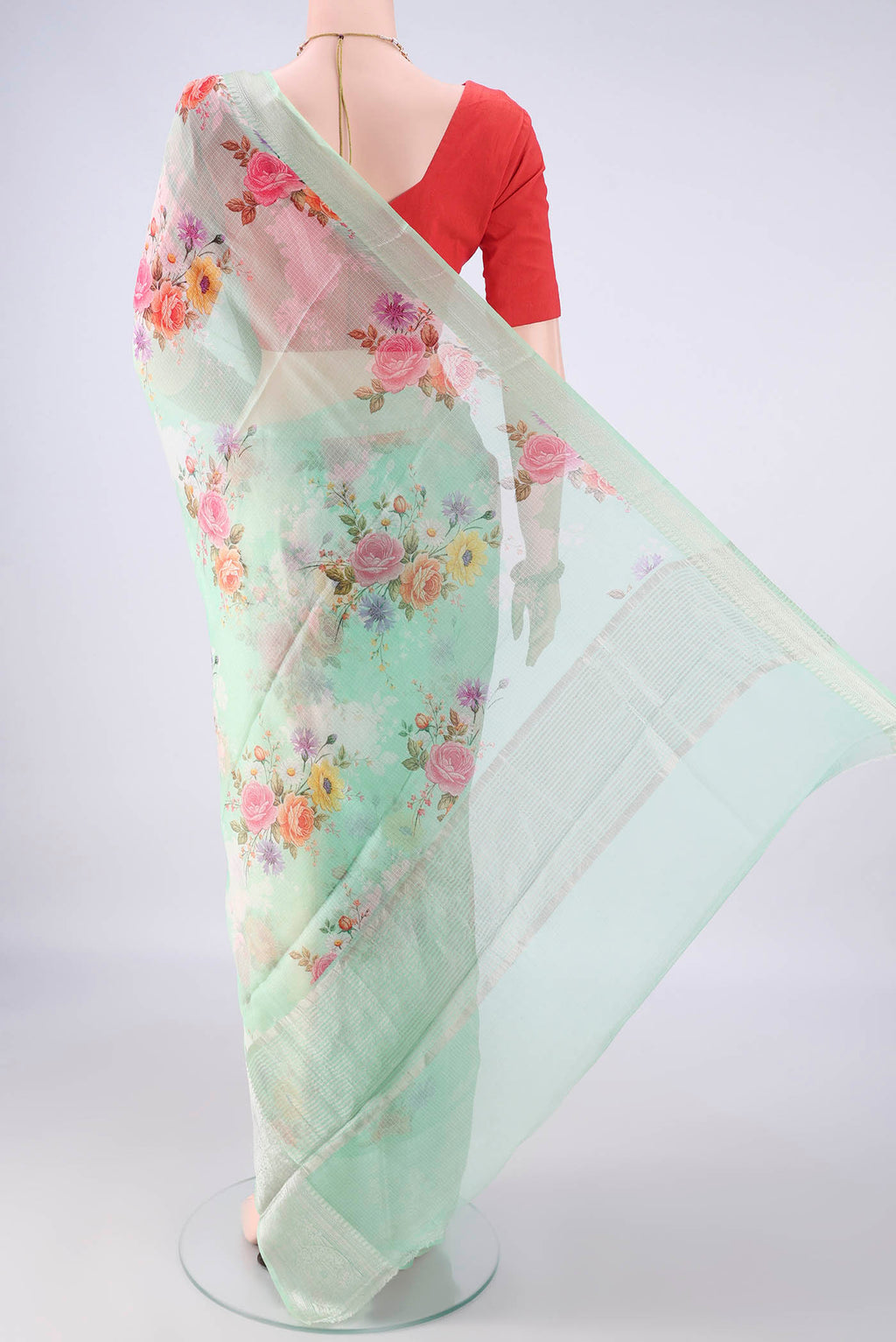 Flat view of Pure Silk Light Green Kota Saree with Floral Print on the body and Zari Border. 