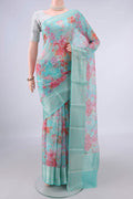Pure Silk Turquoise Kota Saree with Floral Print on the body and Zari Border.  displayed on a mannequin