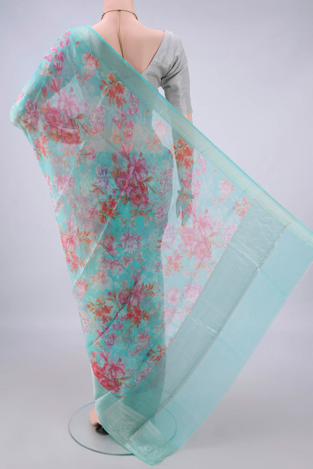 Flat view of Pure Silk Turquoise Kota Saree with Floral Print on the body and Zari Border. 