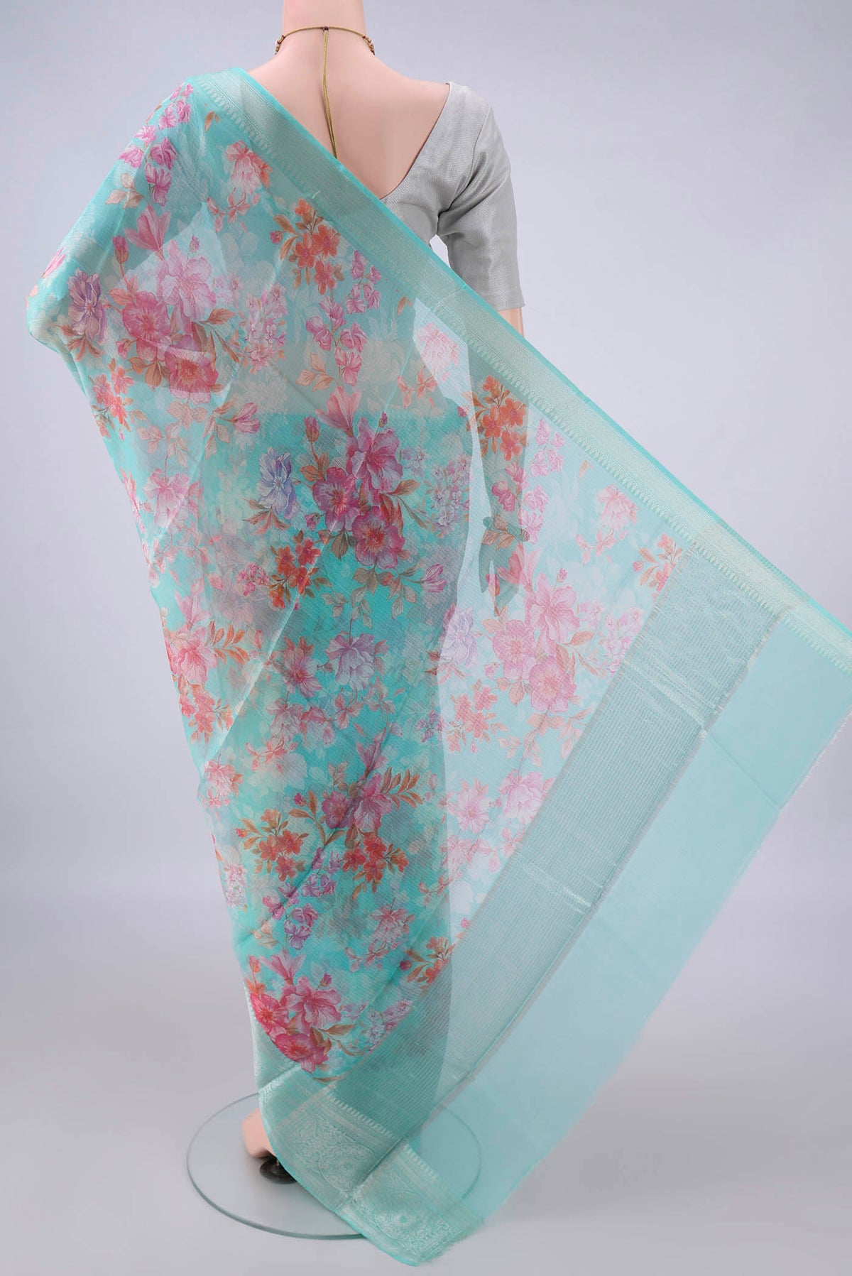 Flat view of Pure Silk Turquoise Kota Saree with Floral Print on the body and Zari Border. 