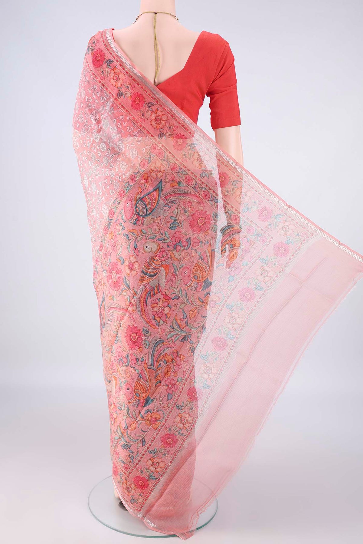 Flat view of Pure Silk Peach Kota Saree with Printed design on the body and Zari Border. 