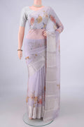 Pure Silk Lilac Kota Saree with Floral Print on the body and Zari Border.  displayed on a mannequin