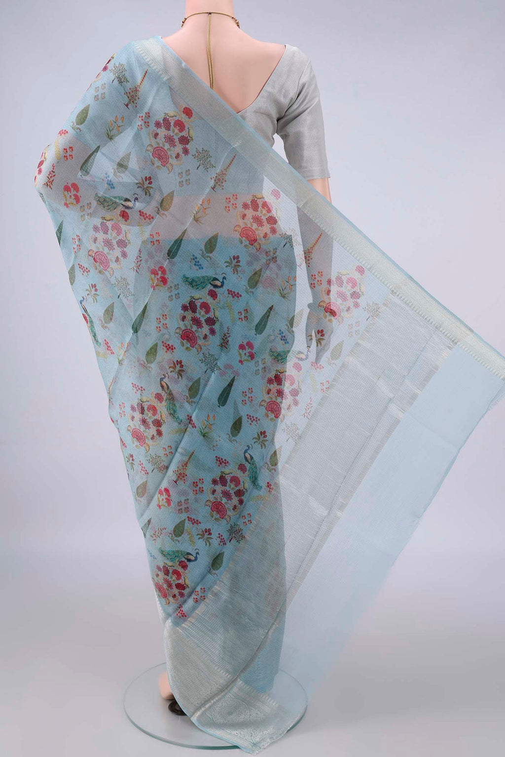 Flat view of Pure Silk Sky Blue Kota Saree with Floral Print on the body and Zari Border. 