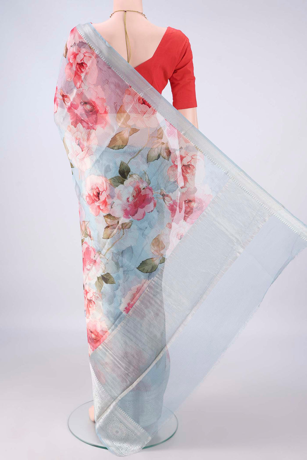 Flat view of Pure Silk Light Blue Kota Saree with Printed design on the body and Zari Border. 