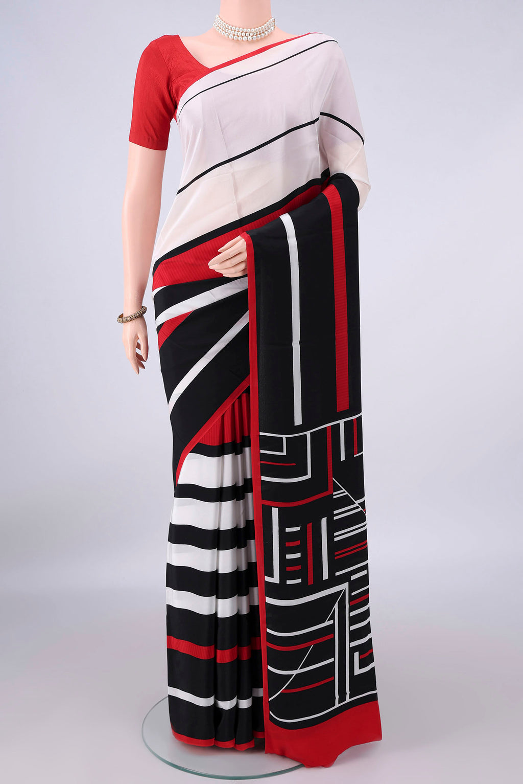 Cream Mysore Crepe Saree with Printed design on the body and Without Border.  displayed on a mannequin