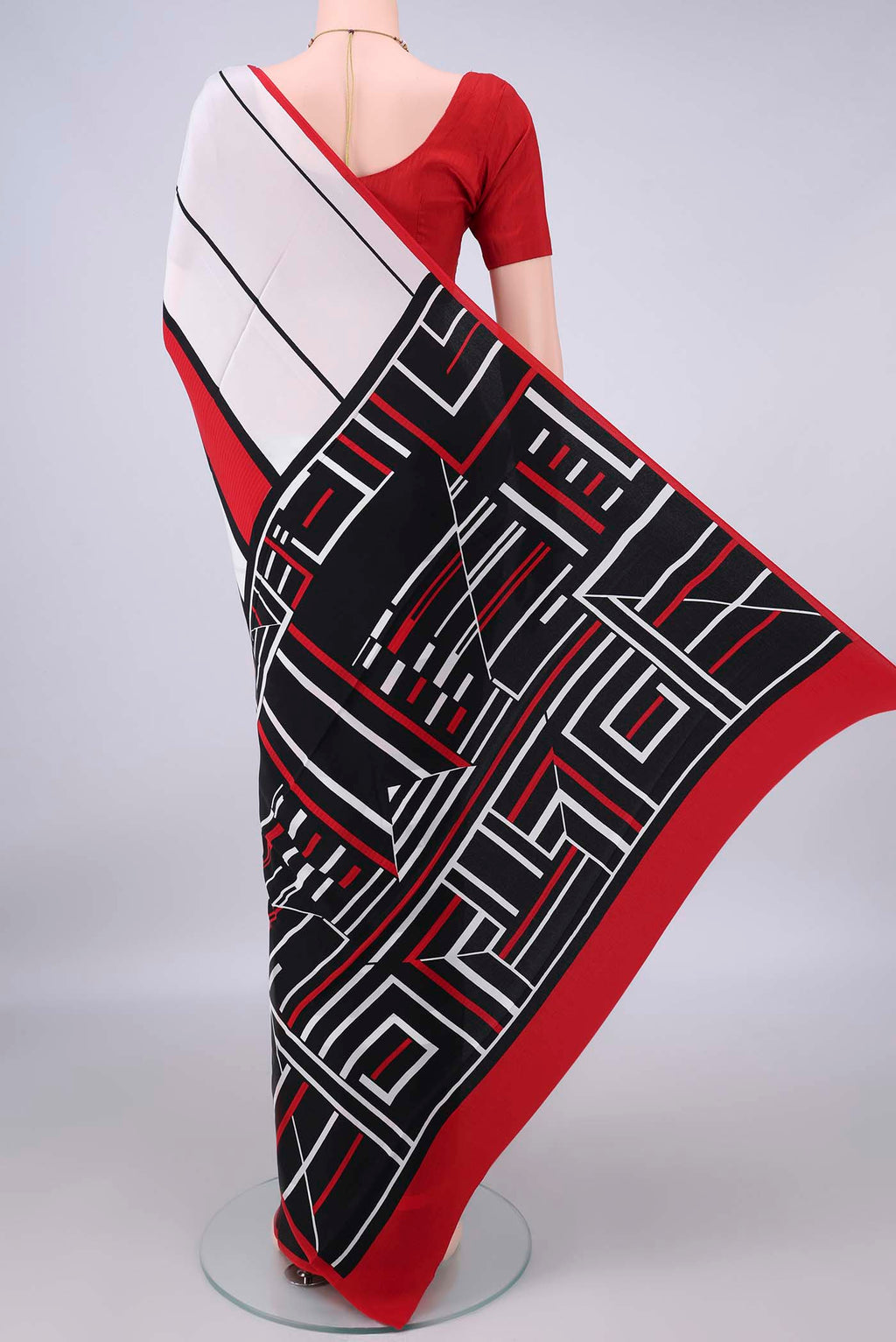 Flat view of Cream Mysore Crepe Saree with Printed design on the body and Without Border. 