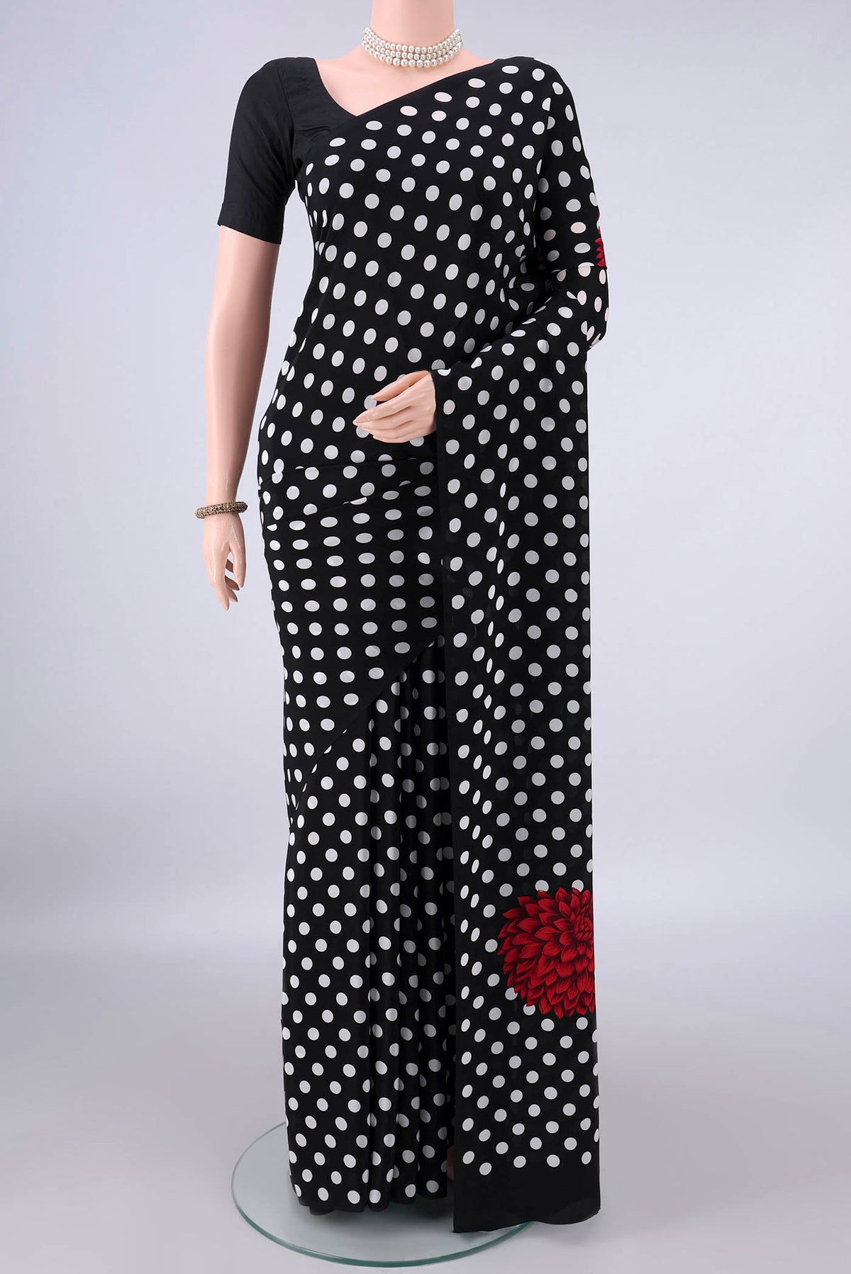 Black Mysore Crepe Saree with Printed design on the body and Plain Border.  displayed on a mannequin