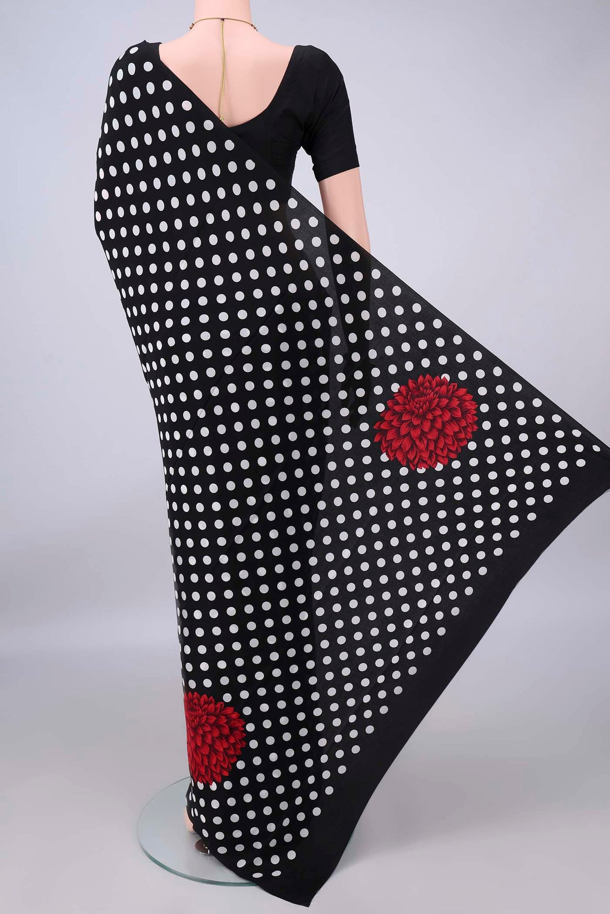 Flat view of Black Mysore Crepe Saree with Printed design on the body and Plain Border. 