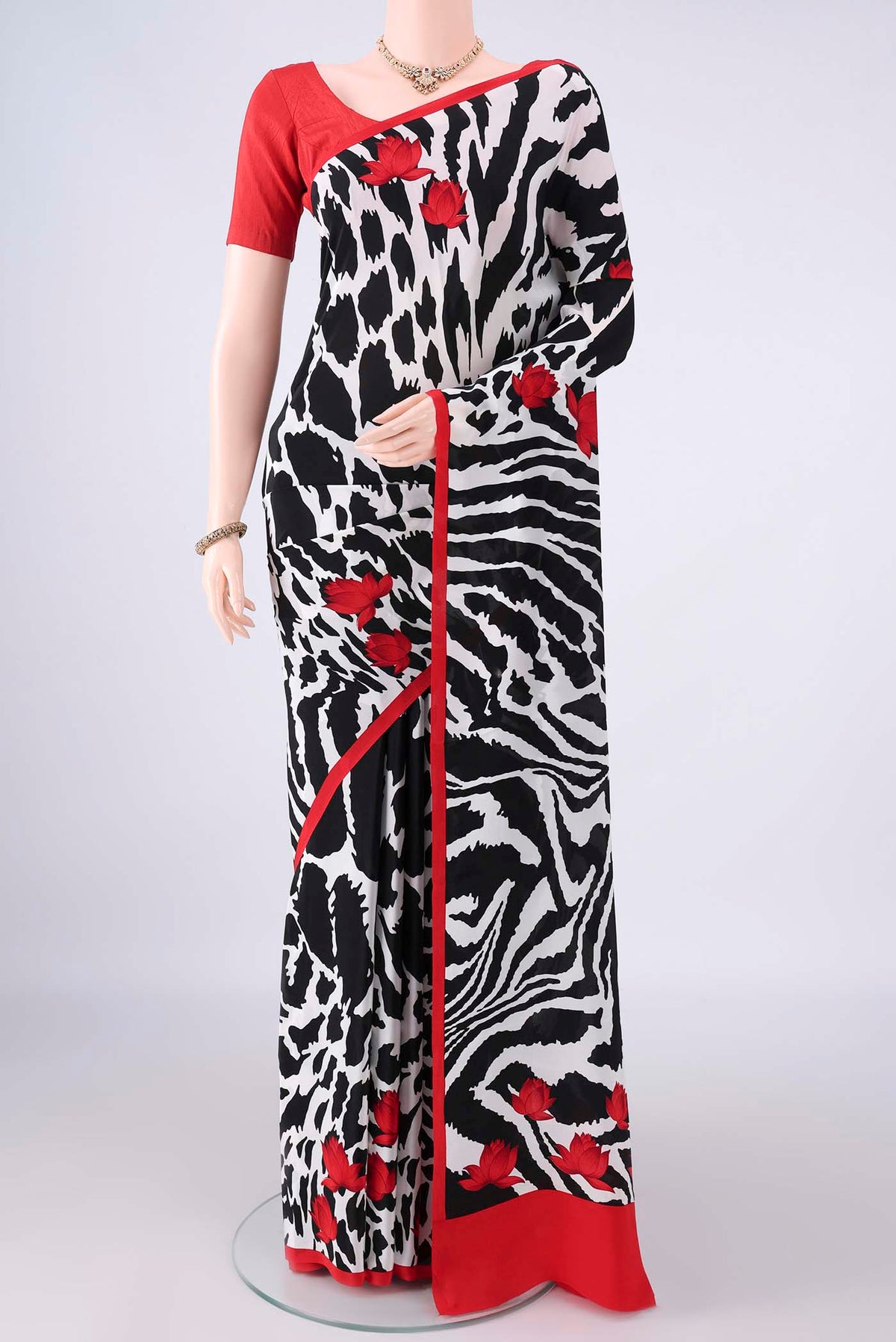 White Mysore Crepe Saree with Printed design on the body and Without Border.  displayed on a mannequin