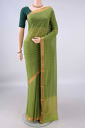 Light Green Mangalagiri Cotton Saree with Printed design on the body and Zari Border.  displayed on a mannequin