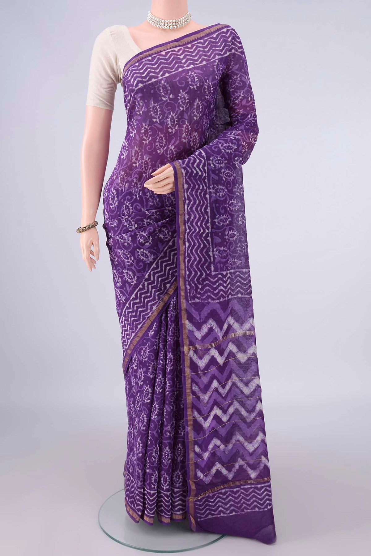 Purple Chanderi Cotton Saree with Batik Print on the body and Thin Zari Line.  displayed on a mannequin