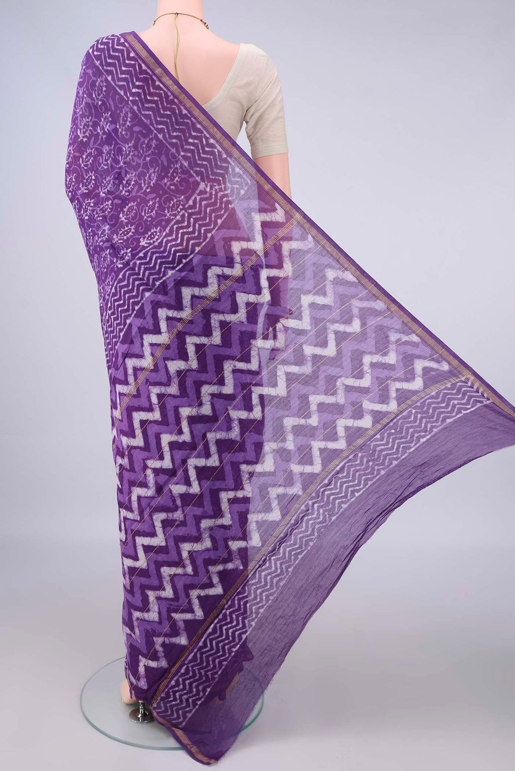 Flat view of Purple Chanderi Cotton Saree with Batik Print on the body and Thin Zari Line. 