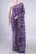 Lilac Chanderi Cotton Saree with Batik Print on the body and Thin Zari Line.  displayed on a mannequin