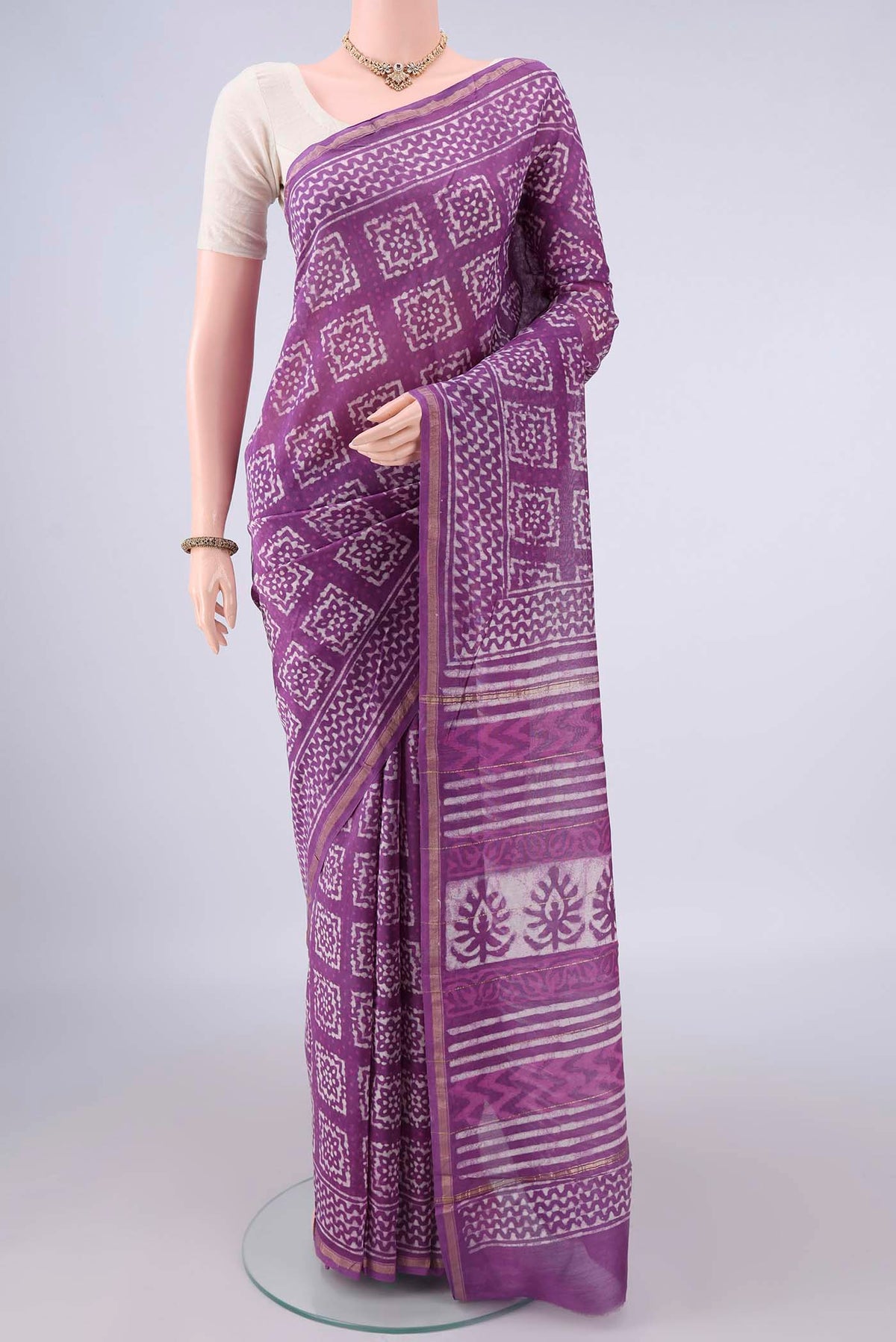 Purple Chanderi Cotton Saree with Batik Print on the body and Thin Zari Line.  displayed on a mannequin