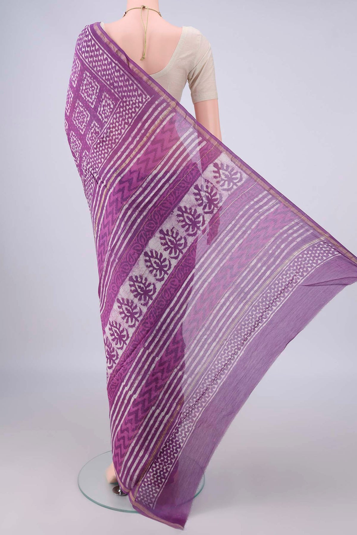 Flat view of Purple Chanderi Cotton Saree with Batik Print on the body and Thin Zari Line. 