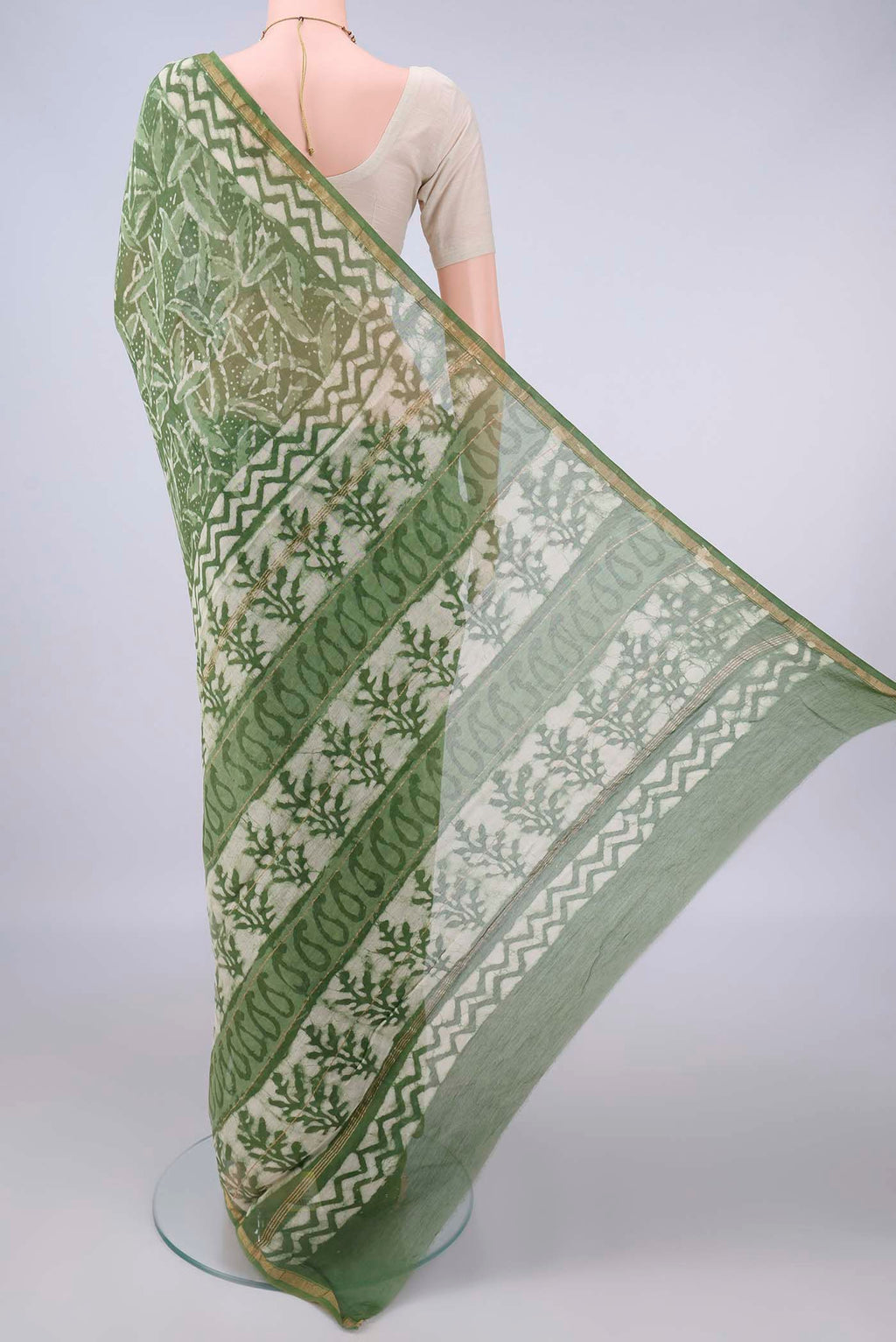 Flat view of Mehandi Green Chanderi Cotton Saree with Batik Print on the body and Thin Zari Line. 