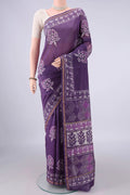 Purple Chanderi Cotton Saree with Batik Print on the body and Thin Zari Line.  displayed on a mannequin