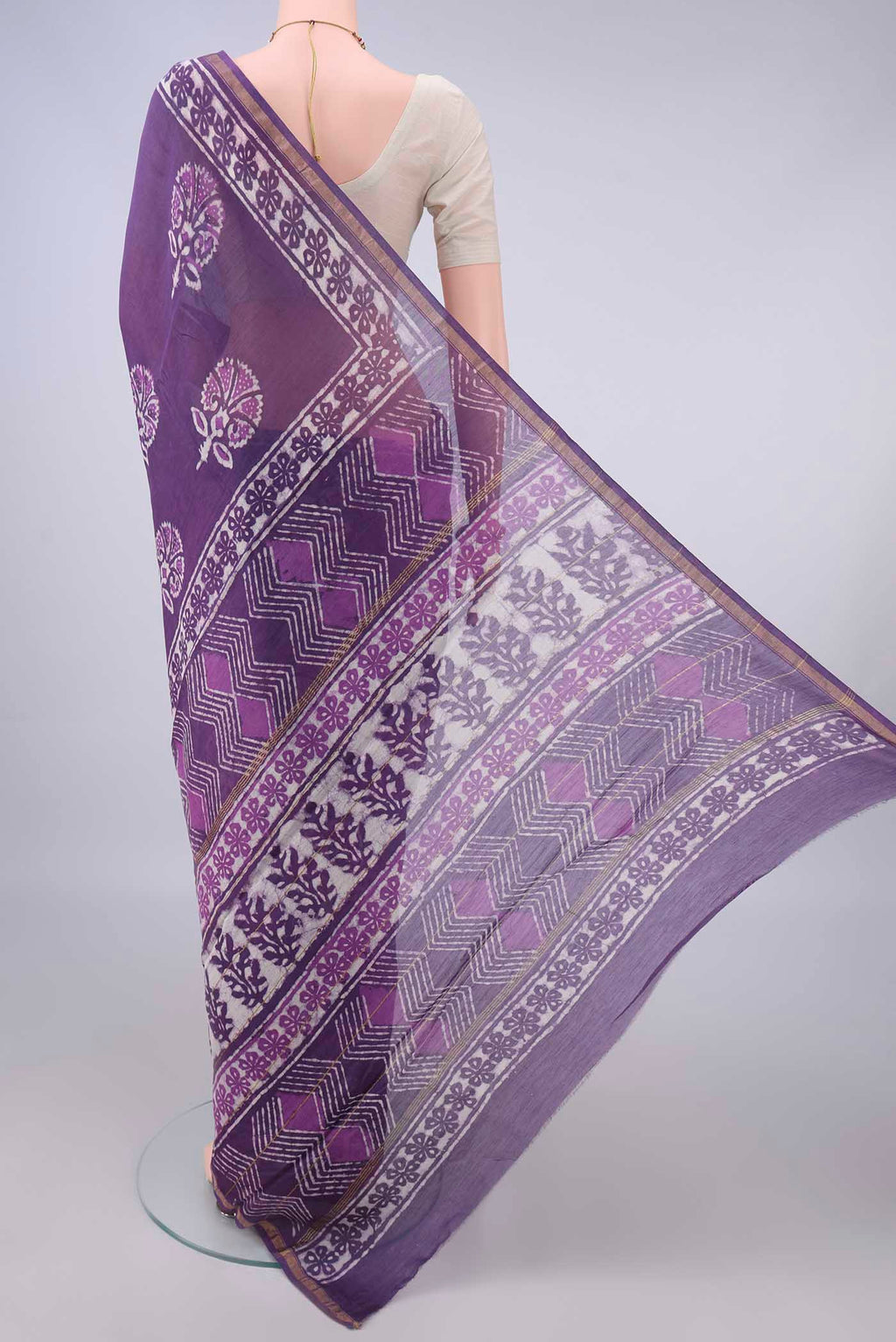 Flat view of Purple Chanderi Cotton Saree with Batik Print on the body and Thin Zari Line. 