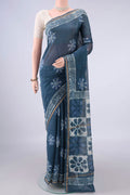 Blue Grey Chanderi Cotton Saree with Batik Print on the body and Thin Zari Line.  displayed on a mannequin