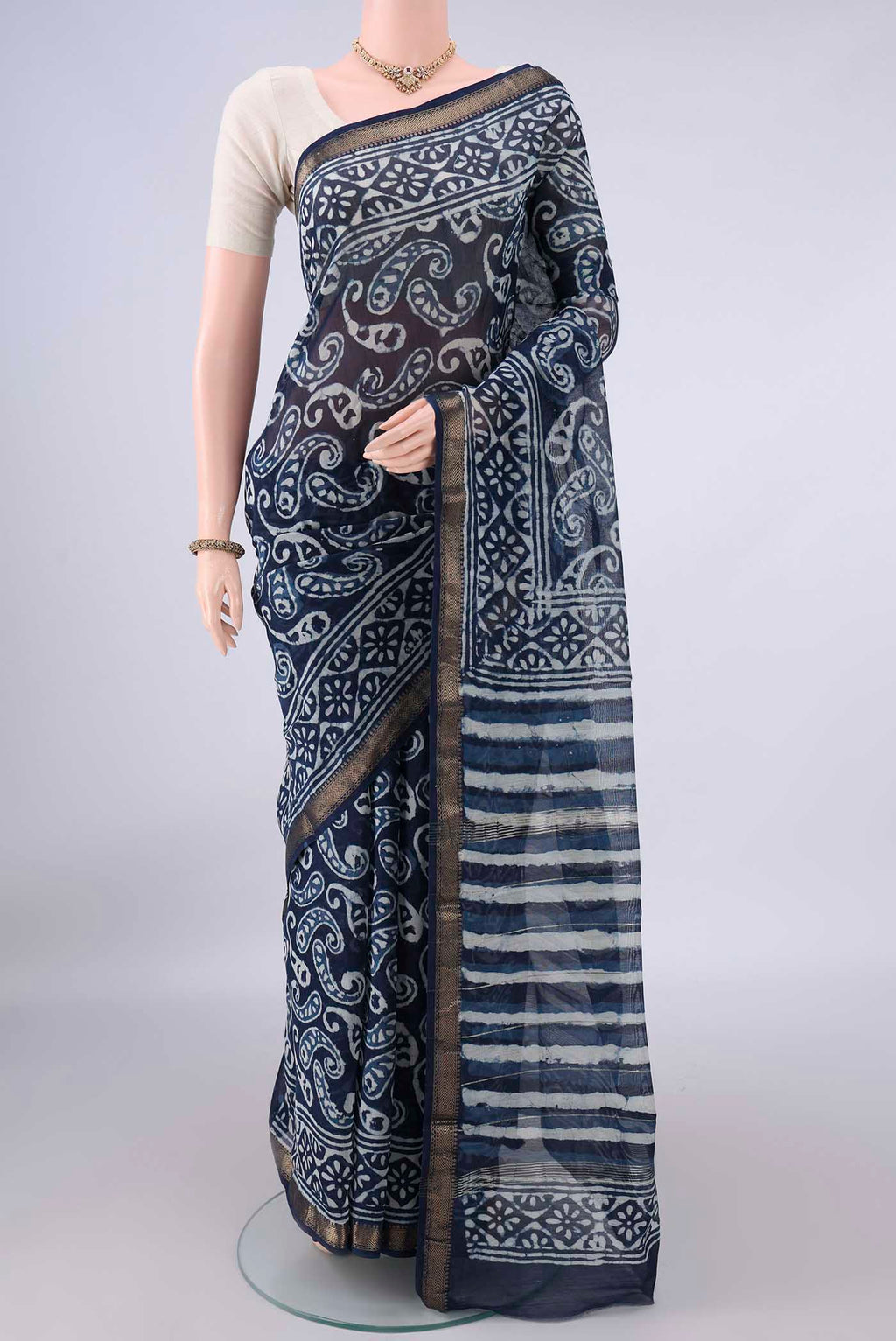 Indigo Mangalagiri Cotton Saree with Batik Print on the body and Zari Border.  displayed on a mannequin