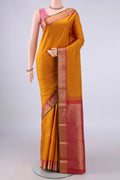 Pure Silk Mustard Kanchipuram Saree with Zari Butta on the body and Zari Border.  displayed on a mannequin