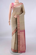 Pure Silk Dark Beige Kanchipuram Saree with Zari Butta on the body and Zari Border.  displayed on a mannequin