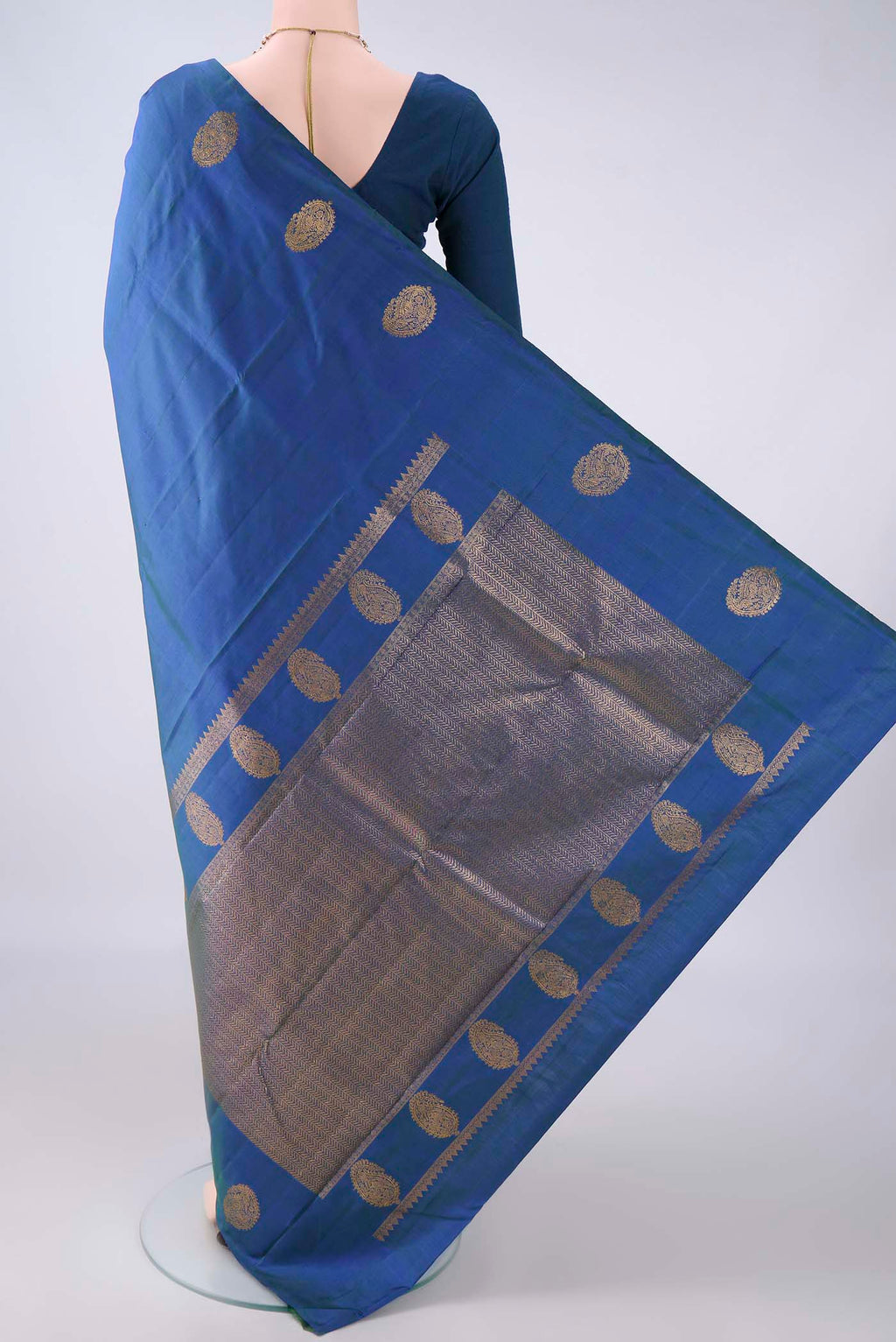 Flat view of Pure Silk Peacock Blue Dual Tone Kanjivaram Saree with Plain Body and Without Border. 
