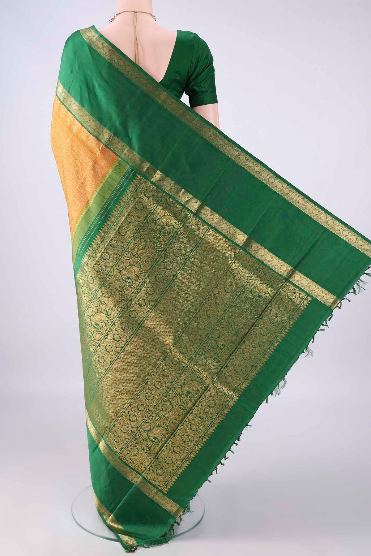 Flat view of Pure Silk Pure Zari Mustard Kanjivaram Saree with Jacquard design on the body and Zari Border. 