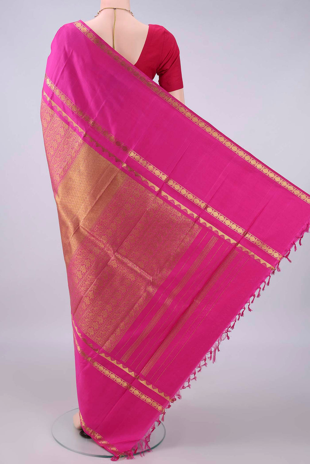 Flat view of Pure Silk Pink Kanchipuram Saree with Zari Brocade on the body and Zari Border. 