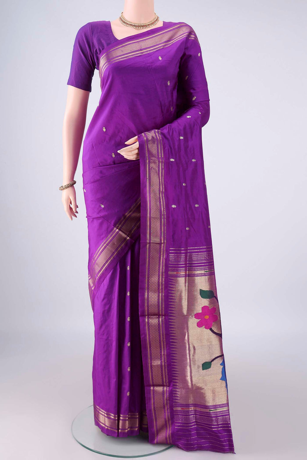 Pure Silk Purple Paithani Saree with Zari Butta on the body and Zari Border.  displayed on a mannequin
