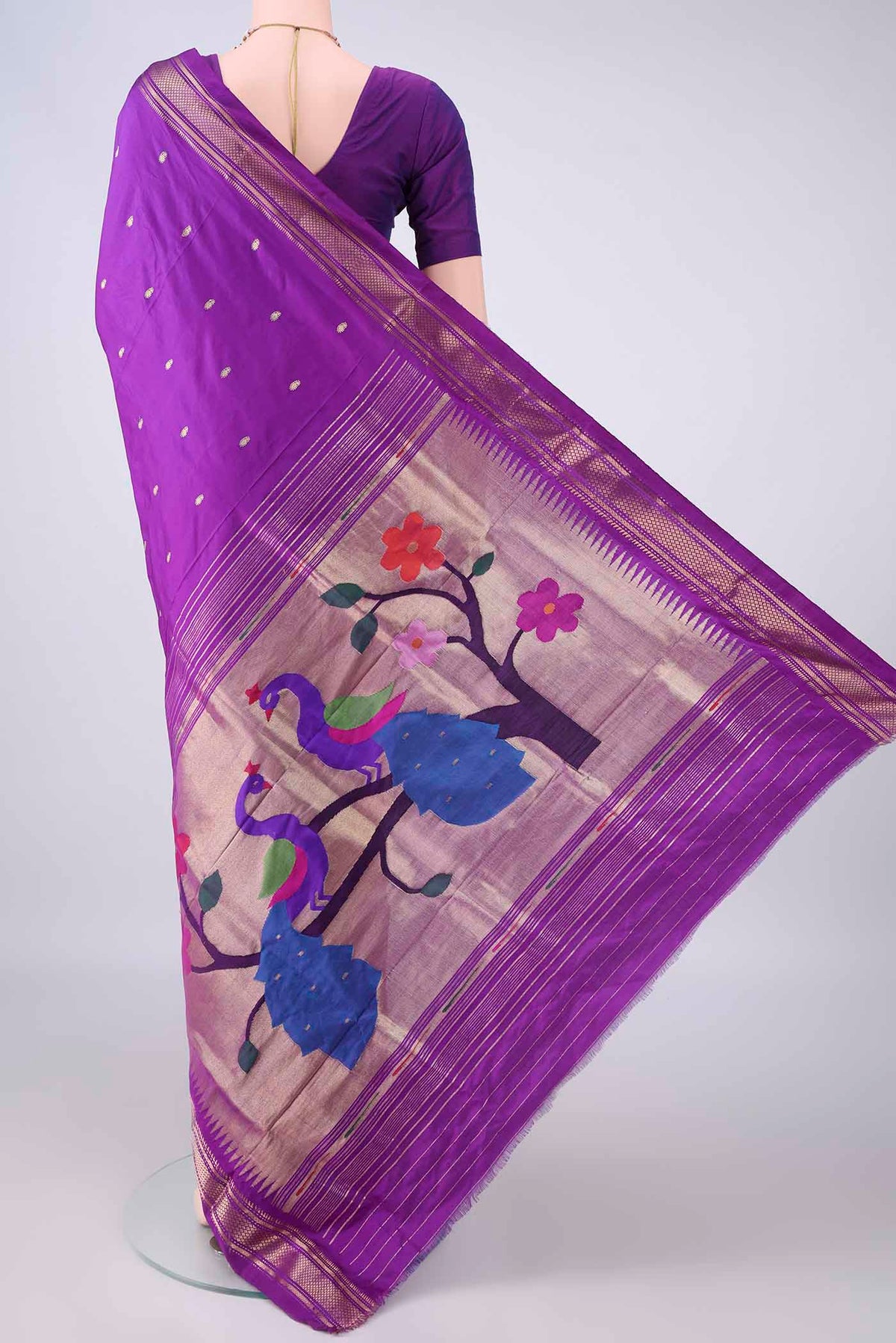 Flat view of Pure Silk Purple Paithani Saree with Zari Butta on the body and Zari Border. 