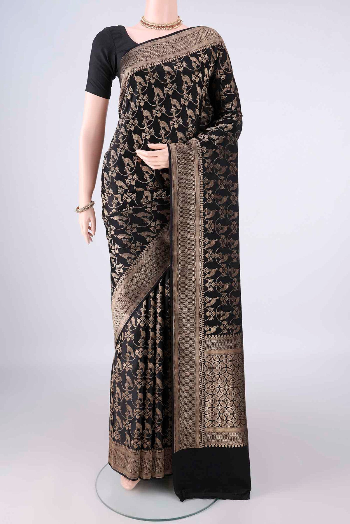 Pure Silk Black Banarasi Saree with Zari Brocade on the body and Zari Border.  displayed on a mannequin