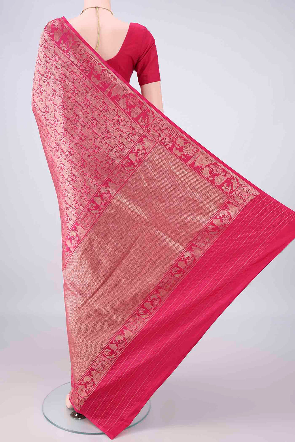 Flat view of Pure Silk Rani Pink Banarasi Saree with Zari Brocade on the body and Zari Border. 