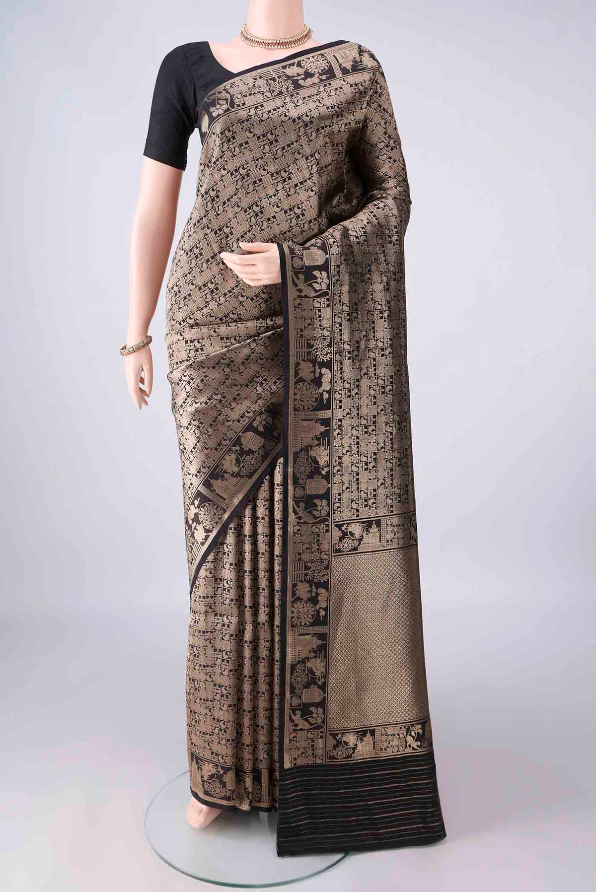 Pure Silk Black Banarasi Saree with Zari Brocade on the body and Zari Border.  displayed on a mannequin