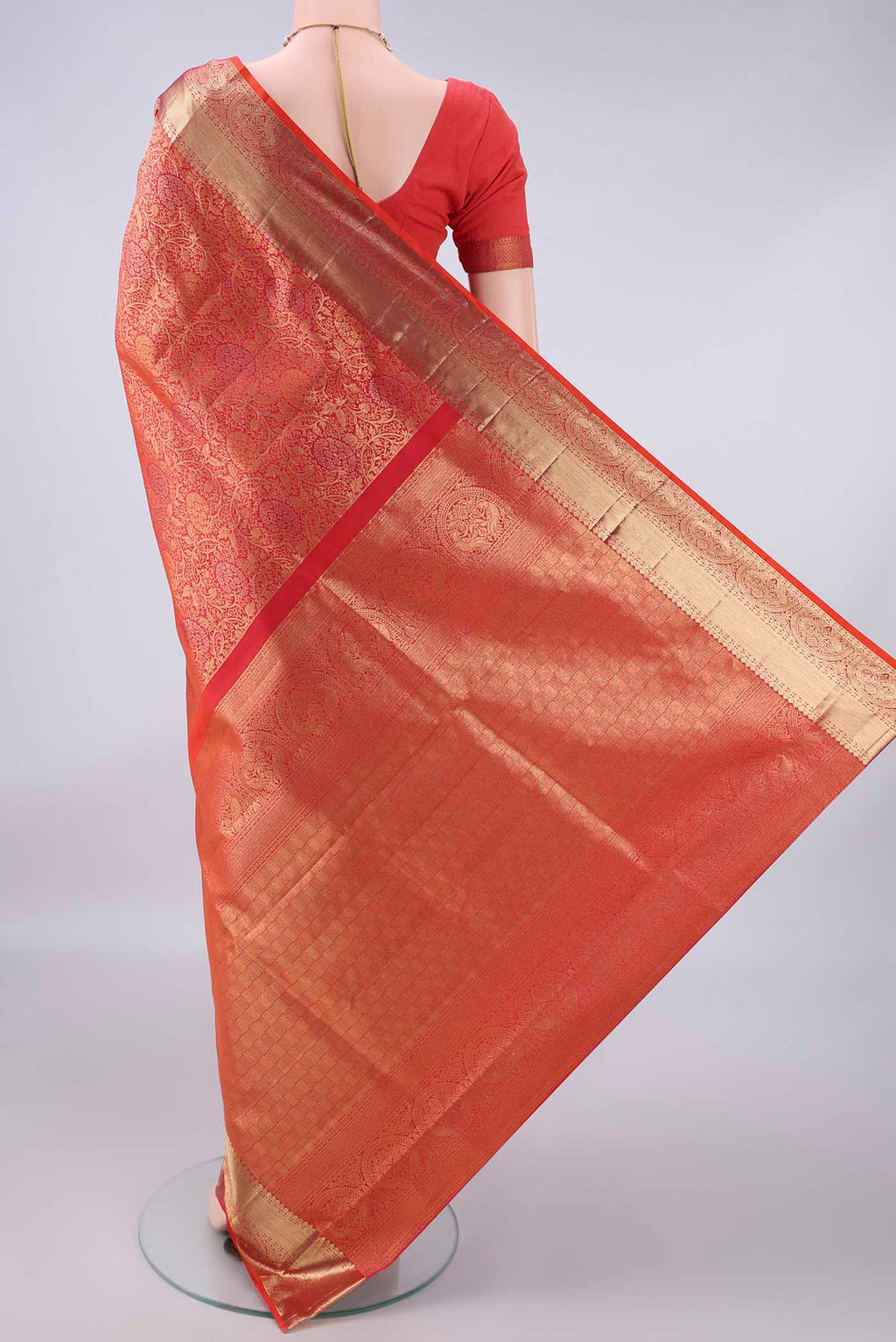 Flat view of Pure Silk Brick Orange Soft Saree with Zari Brocade on the body and Zari Border. 
