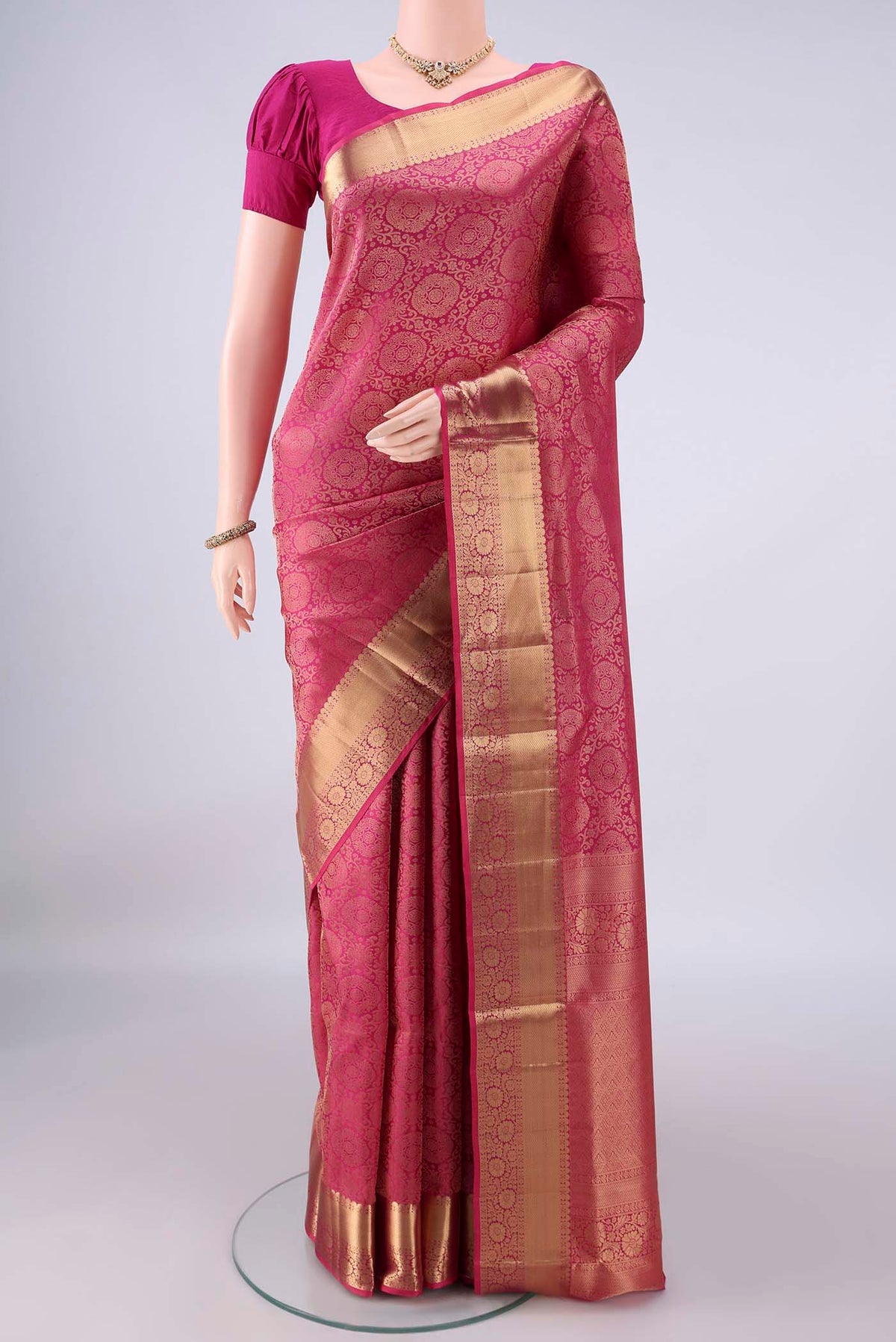 Pure Silk Pink Soft Saree with Zari Brocade on the body and Zari Border.  displayed on a mannequin