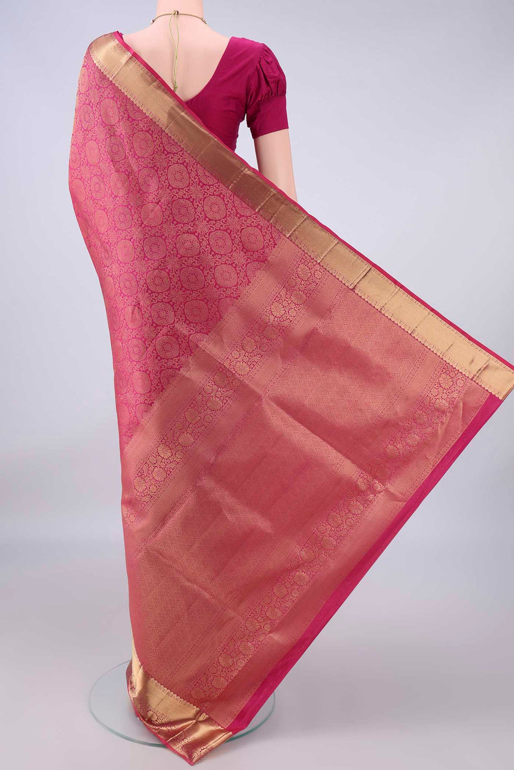 Flat view of Pure Silk Pink Soft Saree with Zari Brocade on the body and Zari Border. 