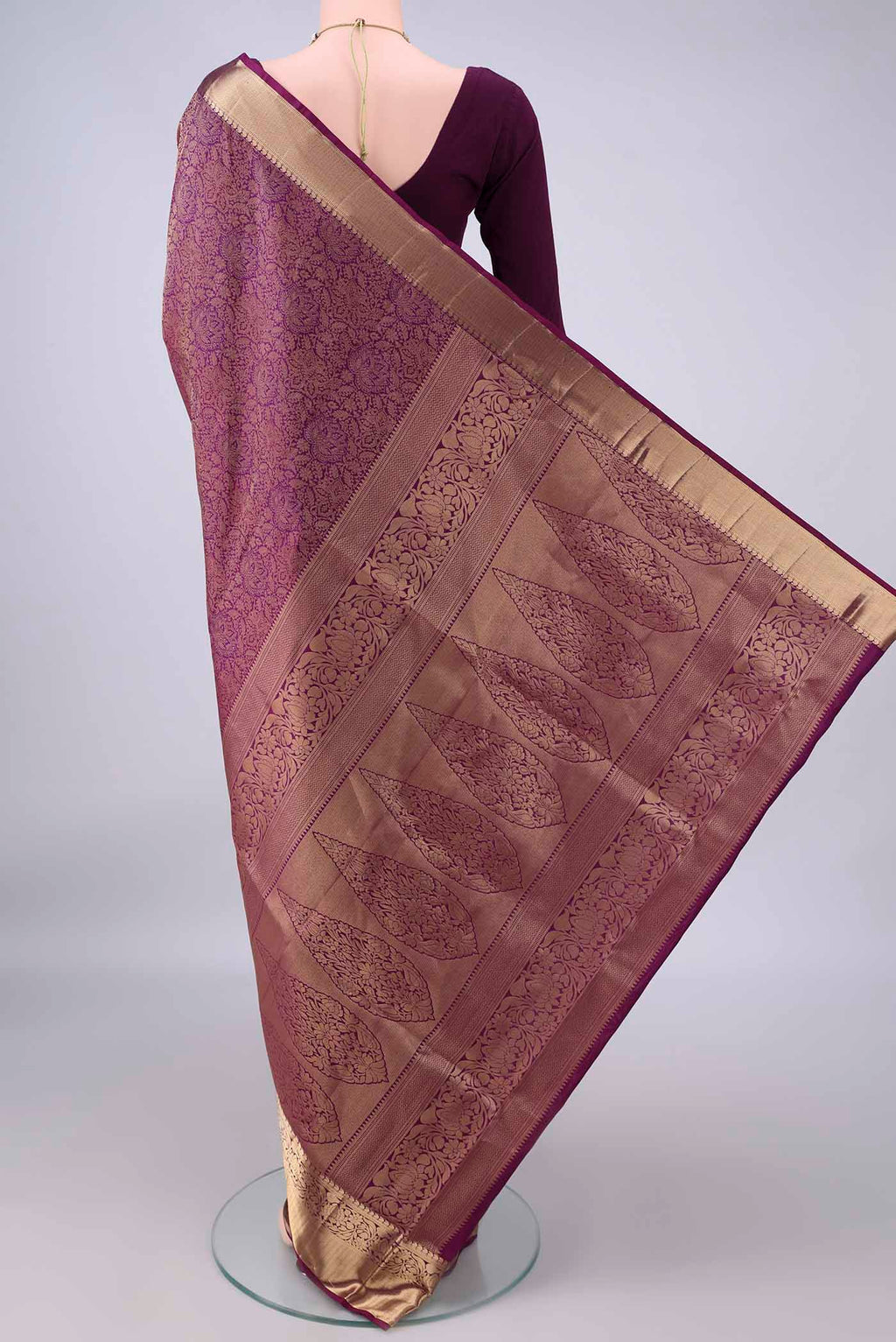 Flat view of Pure Silk Purple Soft Saree with Zari Brocade on the body and Zari Border. 