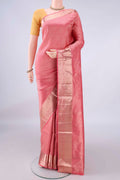 Pure Silk Peach Soft Saree with Zari Brocade on the body and Zari Border.  displayed on a mannequin